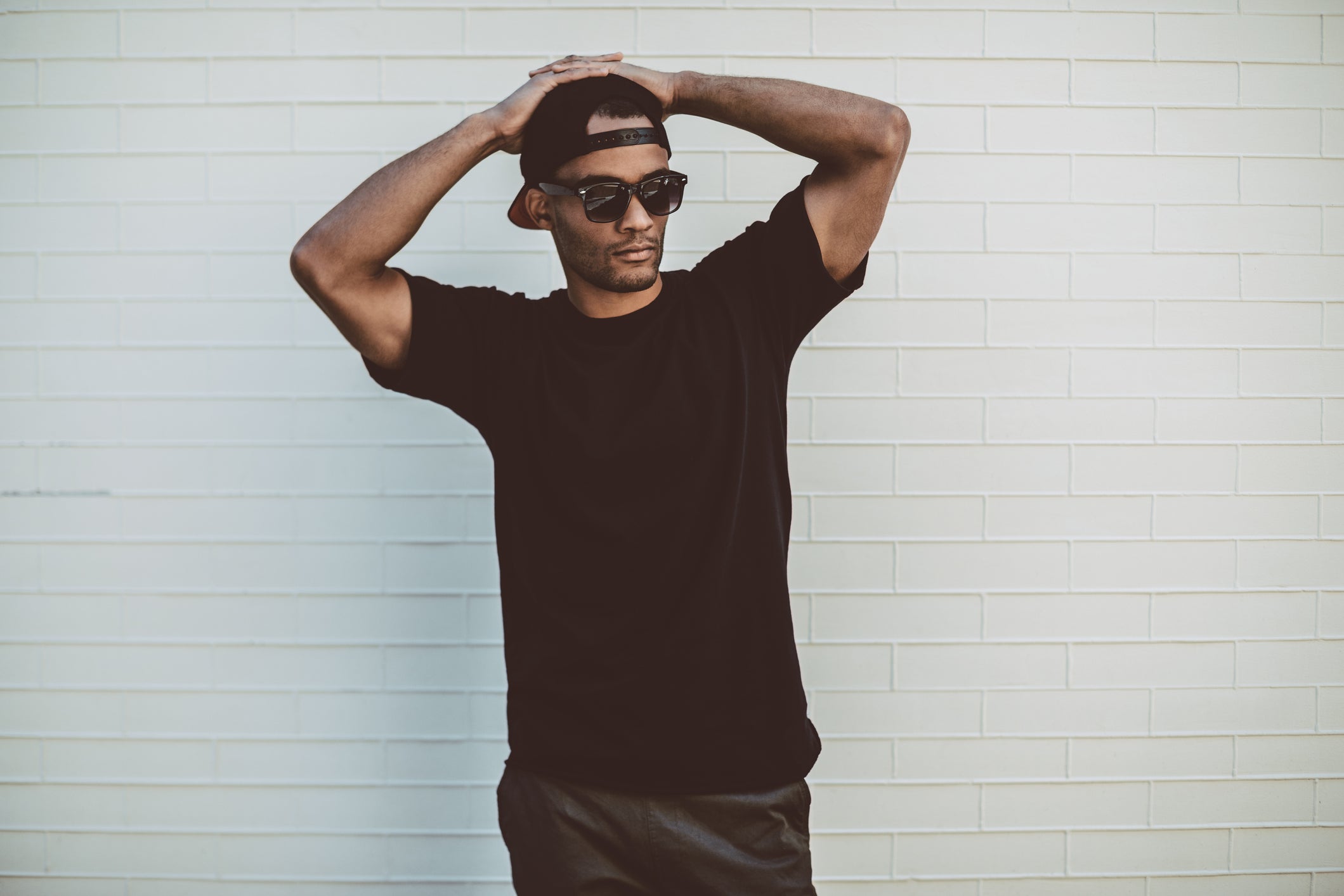 Man with black tshirt and hat bushi.code